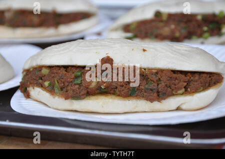 Loaf cake with meat sauce. Stock Photo