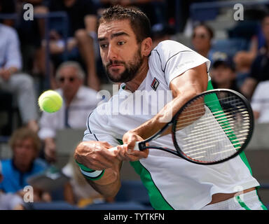 Marin Cilic of Croatia  returns a shot to Kei Nishikori of Japan in their quarter-final match in Arthur Ashe Stadium at the 2018 US Open Tennis Championships at the USTA Billie Jean King National Tennis Center in New York City on September 5, 2018.      Photo by Ray Stubblebine/UPI Stock Photo