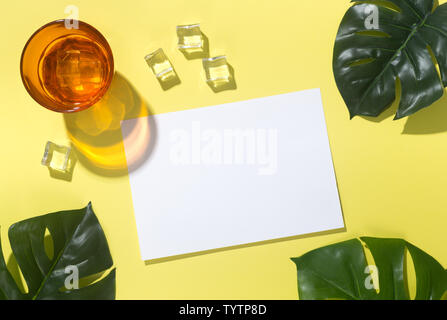 Tropical background with orange neon glass and white paper Stock Photo