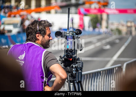 TV Camera Operator at the live event. Television. Telecast. Correspondent. Finishe Stock Photo