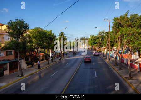 Varadero, Cuba - May 8, 2019: Aerial view from above of a road in a city during a vibrant sunny evening.