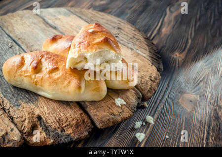 Freshly baked fragrant homemade small meat pies with an appetizing crust. Russian national cuisine. Copy space Stock Photo