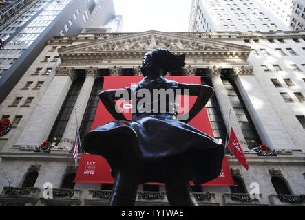 The Fearless Girl statue stands in its new location outside of the NYSE after the opening bell at the New York Stock Exchange on Wall Street in New York City on December 19, 2018.    Photo by John Angelillo/UPI Stock Photo