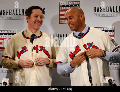 Mike Mussina and Mariano Rivera put on their Hall of Fame uniform