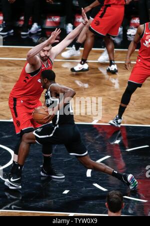 Toronto Raptors center Marc Gasol (33) defends against Brooklyn Nets guard Caris LeVert (22) in the second half at Barclays Center in New York City on April 3, 2019.       Photo by Nicole Sweet/UPI Stock Photo
