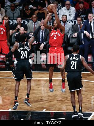 Toronto Raptors forward Kawhi Leonard (2) puts up a shot against Brooklyn Nets forward Rondae Hollis-Jefferson (24) in the second half at Barclays Center in New York City on April 3, 2019.       Photo by Nicole Sweet/UPI Stock Photo