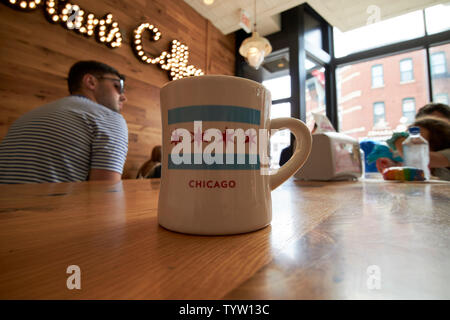 mug of coffee with the chicago flag in stans donuts in wicker park Chicago IL USA Stock Photo