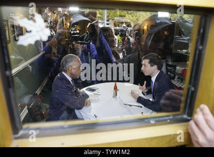 Rev. Al Sharpton and Democratic presidential candidate Pete Buttigieg meet at Sylvia's Restaurant in Harlem on April 29, 2019 in New York City. Rev. Sharpton has hosted several candidates at Sylvia's over the years, including President Barack Obama in 2007 and Sen. Kamala Harris (D-CA) earlier this year.      Photo by John Angelillo/UPI Stock Photo