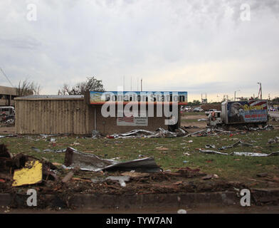 A path of destruction is seen in the aftermath of a series of tornadoes ...