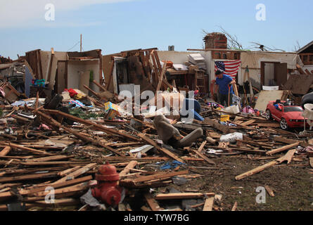 A path of destruction is seen in the aftermath of a series of tornadoes ...