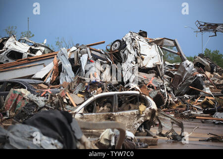 A path of destruction is seen in the aftermath of a series of tornadoes ...