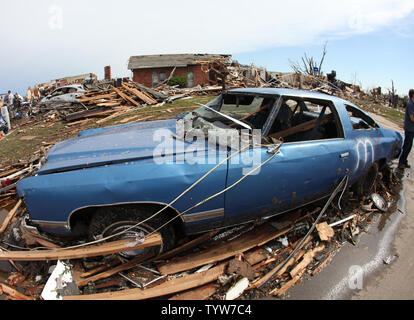 A path of destruction is seen in the aftermath of a series of tornadoes ...