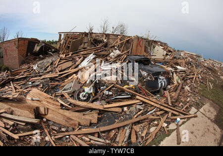 A path of destruction is seen in the aftermath of a series of tornadoes ...