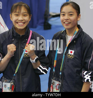 Japanese gymnasts Kyoko Oshima (L) and Manami Ishizaka are excited to be at their first Olympic Games having just seen the gymnastics venue at the Olympic Indoor Hall on August 9, 2004.  The 28th Olympic Games will be held in Athens on August 13-29, 2004.   (UPI Photo/Grace Chiu) Stock Photo