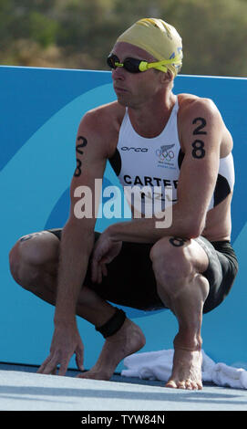 Hamish Carter of New Zealand prepares for the start of the Olympic men's triathlon at the Vouliagmeni Olympic Complex on August 26, 2004.  Carter raced in the lead pack,  finishing  the race in 1:51:07.73 hours and capturing the gold medal.  (UPI Photo / Grace Chiu) Stock Photo