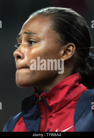 USA's Marion Jones ends her attempts at winning an Olympic long jump medal at the Athens Olympic Stadium on August 27, 2004.  Jones finishes in fifth place with a second-round jump of 6.85 meters. (UPI Photo / Grace Chiu) Stock Photo