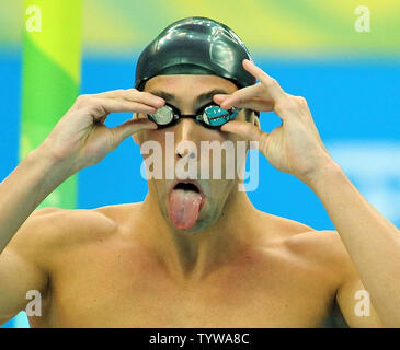 USA's Michael Phelps adjusts his goggles before competing in the Men's 400 Meter Individual Medley final at the National Aquatic Center (Water Cube) during the 2008 Summer Olympics in Beijing, China, on August 10, 2008. Phelps won gold.   (UPI Photo/Roger L. Wollenberg) Stock Photo