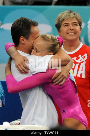 USA's Nastia Liukin is hugged by her father and coach Valeri after it was announced that she had won the gold medal in the Women's Individual All-Around Gymnastics Final at the National Indoor Stadium at the Summer Olympics in Beijing on August 15, 2008.   Liukin was born in 1989 in Moscow in the former Soviet Union, now Russia.  Her father won four medals, two gold, at the 1988 Olympics for the Soviet Union.  (UPI Photo/Pat Benic) Stock Photo