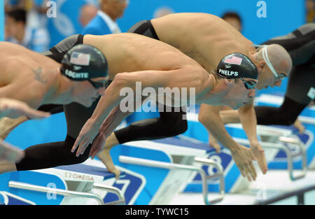 USA's Ryan Lochte, USA's Michael Phelps and Hungary's Laszlo Cseh (L to R) start the Men's 200M Individual Medley at the National Aquatic Center (Water Cube) during the 2008 Summer Olympics in Beijing, China, on August 15, 2008. Phelps won gold, Cseh silver and Lochte bronze.   (UPI Photo/Roger L. Wollenberg) Stock Photo