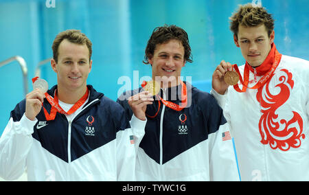 USA's Aaron Peirsol (silver), Ryan Lochte (gold) and Russia's Arkady Vyatchanin (bronze) (L to R) show off their medals earned in the Men's 200M Backstroke at the National Aquatic Center (Water Cube) during the 2008 Summer Olympics in Beijing, China, on August 15, 2008. Lochte set a world record of 1:53.94.   (UPI Photo/Roger L. Wollenberg) Stock Photo