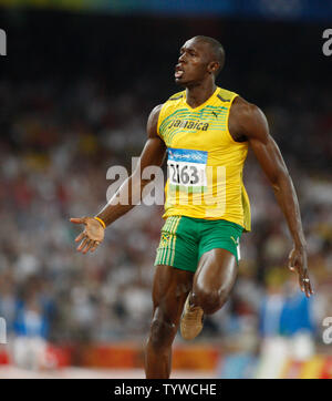 Jamaica's Usain Bolt (2163) runs down the track in a world record time ...