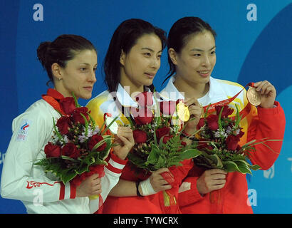 Russia's Julia Pakhalina (silver), China's Jingjing Guo (gold) and China's Minxia Wu (bronze) (L to R) hold their medals earned in the Women's 3M Springboard final at the National Aquatic Center (Water Cube) during the 2008 Summer Olympics in Beijing, China, on August 17, 2008.    (UPI Photo/Roger L. Wollenberg) Stock Photo