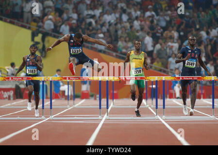 USA's Angelo Taylor (3239)takes the final hurdle and gold in the 400m hurdles at the Summer Olympics in Beijing on August 18, 2008. The USA swept the medals as Taylor took gold with a time of 47.25, Kerron Clement (3149) took silver at 47.98 and Bershawn Jackson (L), bronze at 48.06.  (UPI Photo/Terry Schmitt) Stock Photo
