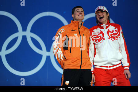Sven Kramer of the Netherlands celebrates his gold medal while Ivan Skobrev of Russia celebrate his bronze in men's 5000 meter speed skating during a Medal Ceremony at BC Place in Vancouver, Canada, during the 2010 Winter Olympics on February 14, 2010.     UPI/Roger L. Wollenberg Stock Photo