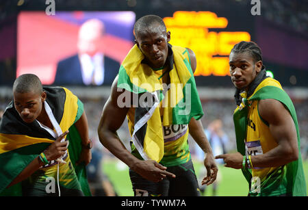 Jamaica's Usain Bolt poses with teammates Yohan Blake (R) and  Warren Weir  (L) after winning the gold medal in the Men's 200M Final at Olympic Stadium during the London 2012 Summer Olympics in Olympic Park in Stratford, London on August 9, 2012.  Bolt became the first Olympian to win the 100M and 200M race in consecutive Olympics. His time was 19.32.  Jamaica swept the race with teammates Yohan Blake getting the silver and Warren Weir the bronze medal.    UPI/Pat Benic Stock Photo