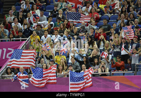 Fans wave American flags as the United States team won the gold medal in the Women's Team Finals at the Greenwich North Arena at the 2012 Summer Olympics, July 31, 2012, in London, England.              UPI/Mike Theiler Stock Photo