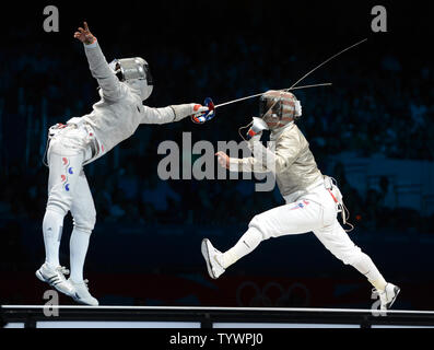 Jiyeon Kim of Korea (L) fences with Mariel Zagunis of the USA  in Women's Individual Sabre semifinals at the ExCel exhibition center at the London 2012 Summer Olympics on August 1, 2012 in London.  Kim defeated Zagunis, a two time gold medalist.  UPI/Terry Schmitt Stock Photo