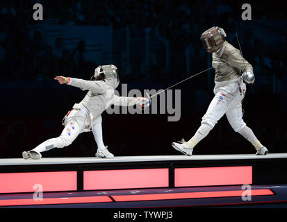 Jiyeon Kim of Korea (L) fences with Mariel Zagunis of the USA  in Women's Individual Sabre semifinals at the ExCel exhibition center at the London 2012 Summer Olympics on August 1, 2012 in London.  Kim defeated Zagunis, a two time gold medalist.  UPI/Terry Schmitt Stock Photo