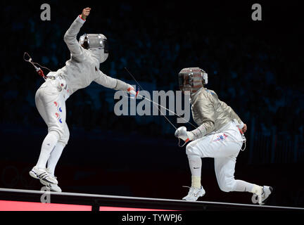 Jiyeon Kim of Korea (L) fences with Mariel Zagunis of the USA  in Women's Individual Sabre semifinals at the ExCel exhibition center at the London 2012 Summer Olympics on August 1, 2012 in London.  Kim defeated Zagunis, a two time gold medalist.  UPI/Terry Schmitt Stock Photo