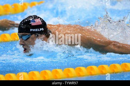 USA's Michael Phelps glides through the water to a Gold Medal in the  Men's 100 Butterfly Final at the Aquatics Center during the London 2012 Summer Olympics in Stratford, London on August 3, 2012.    UPI/Pat Benic Stock Photo