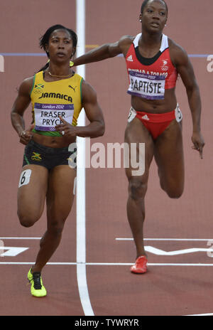 Jamaica's Shelly-Ann Fraser-Pryce (L) in action as she wins her Women's 100m semifinal, and Trinidad's Kelly-Ann Baptiste (R) finished third, at the 2012 Summer Olympics, August 4, 2012, in London, England.             UPI/Mike Theiler Stock Photo