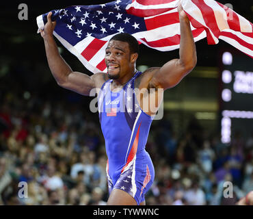 United States' Jordan Ernest Burroughs, in blue, competes against Iran ...