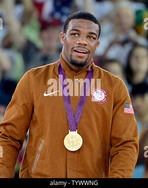 United States' Jordan Ernest Burroughs, in blue, competes against Iran ...