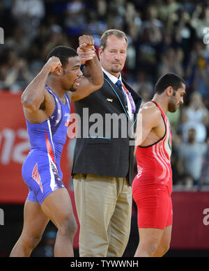 United States' Jordan Ernest Burroughs, in blue, competes against Iran ...