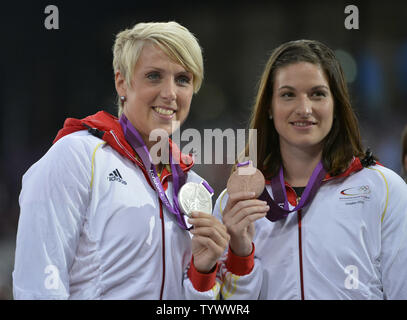 Silver Medalist Christina Obergfoll of Germany (L)  and teammate Linda Stahl hold their medals during the Victory Ceremony for the Women's Javelin Throw at the London 2012 Summer Olympics on August 10, 2012 in Stratford, London. Obergfoll hit a mark of 65.16 and Stahl threw a season-best 64.91 in the final.      UPI/Brian Kersey Stock Photo