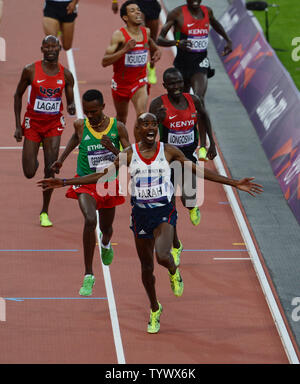 Great Britain's Mo Farah raises his arms as he wins the Men's 5000 metres final on the ninth day of the Athletics in the Olympics stadium at the London 2012 Summer Olympics on August 11, 2012 in  London.     UPI/Hugo Philpott Stock Photo