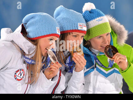 From left to right, silver medalist Norway's Tora Berger, gold medalist Belarus' Darya Domracheva and bronze medalist Slovenia's Teja Gregorin pose during the victory ceremony for the biathlon women's pursuit at the Sochi 2014 Winter Olympics on February 12, 2014 in Sochi, Russia. UPI/Kevin Dietsch Stock Photo