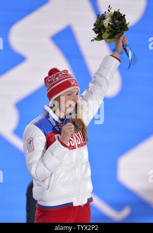 Russia's Alena Zavarzina holds her bronze medal during the victory ceremony for ladies' snowboard parallel giant slalom at the Sochi 2014 Winter Olympics on February 19, 2014 in Sochi, Russia.     UPI/Brian Kersey Stock Photo