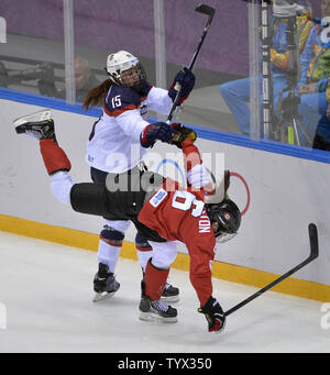 USA defenseman Anne Schleper (15) cross checks Canada forward Jayna Hefford  (16) in the second period of the women's hockey gold medal game at the  Bolshoy Ice Dome during the Winter Olympics