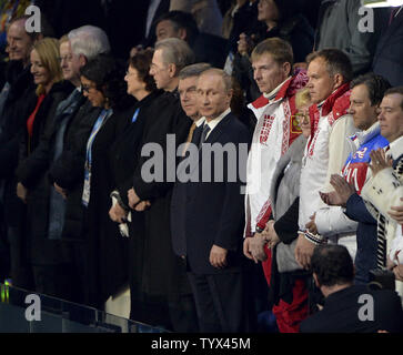 Russian President Vladimir Putin (C) watches the Closing Ceremony at the Sochi 2014 Winter Olympics on February 23, 2014 in Sochi, Russia.        UPI/Kevin Dietsch Stock Photo