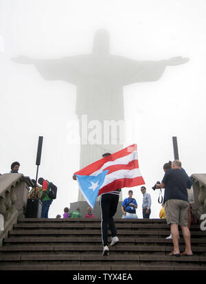 A photo shows Christ the Redeemer, Statue of Christ, at Corcovado in ...