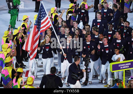Michael Phelps holds the American flag as he leads the United States in the arena at the Opening Ceremony of the 2016 Rio Summer Olympics begins in Rio de Janeiro, Brazil on August 5, 2016.     Photo by Terry Schmitt/UPI Stock Photo