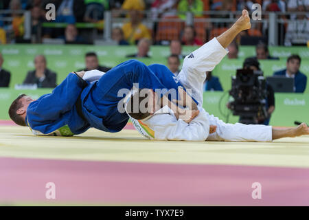 Dirk Van Tichelt of Belgium in blue during the Men's 73kg Judo bronze medal match  at Carioca Arena 2 in Rio de Janeiro, Brazil, August 8, 2016. Van Tichelt won the bronze medal and was later mugged celebrating on Copacabana Beach.     Photo by Richard Ellis/UPI.. Stock Photo