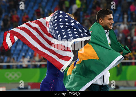 Pole vault bronze medalist Sam Kendricks of the USA (L) celebrates with gold medal winner Thiago Braz Da Silva of Brazil in the Olympic Stadium at the 2016 Rio Summer Olympics in Rio de Janeiro, Brazil, on August 15, 2016. Richard Ellis/UPI Stock Photo