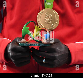 Thiago Braz da Silva of Brazil holds his award as he wears the gold medal for Pole Vault at the 2016 Rio Summer Olympics in Rio de Janeiro, Brazil, August 16, 2016.     Photo by Terry Schmitt/UPI Stock Photo