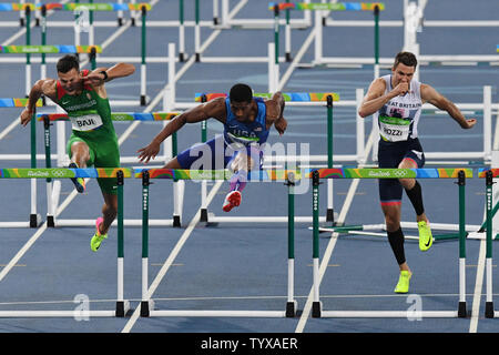 Ronnie Ash of the USA, center, during the Men's 110m Hurdles Semifinal 1 in the Olympic Stadium at the 2016 Rio Summer Olympics in Rio de Janeiro, Brazil, on August 16, 2016.  Ash came in second in the semifinal with a time of 13.36.      Photo by Richard Ellis/UPI Stock Photo